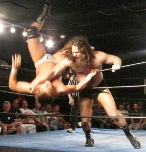 Actors depict Coleman upended by referee Luke Hattie, tastefully substituting an arm instead of his derriere to indicate the clothesline check Wednesday night