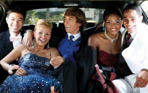Woods (far left) heading to prom clearly without a date, but happy to be part of a  multi-cultural ride to the high school gym.